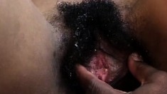 Chocolate slut gets her hairy cunt shaved before she takes in a cock