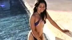 Smoking hot chick takes off her bathing suit to reveal a pair of perky tits