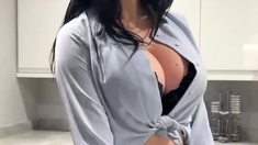 Brunette seductress working her big boobs and hot ass
