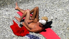 Nude girl picked up by voyeur cam at nude beach