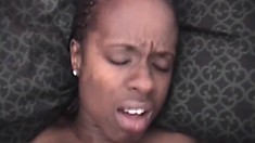 Lovely black girl lies on her back and has a stiff white dick fucking her cunt deep