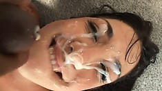 Nasty brunette Lexi Bardot has three guys covering her face with cum
